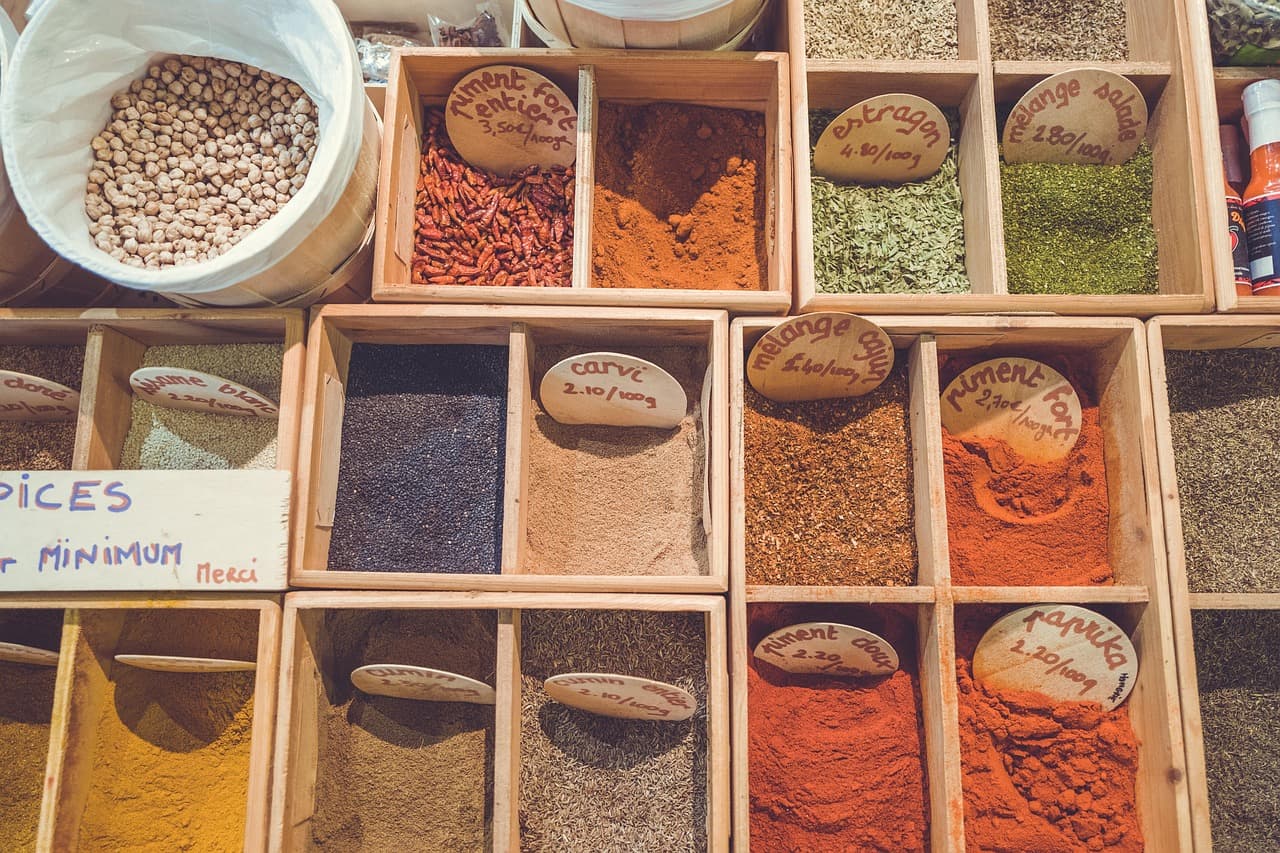 Boxes of loose spices at a market