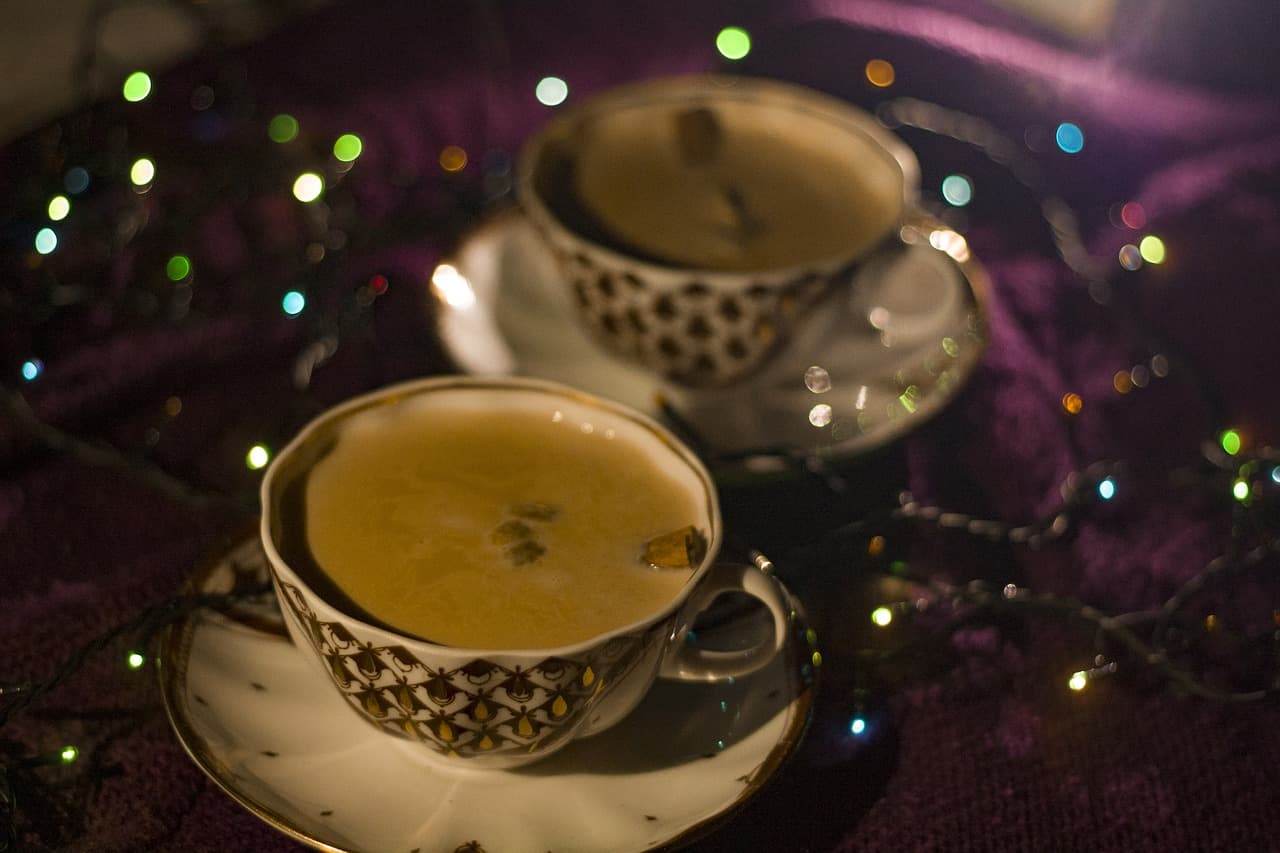 Two cups of milky spiced tea
